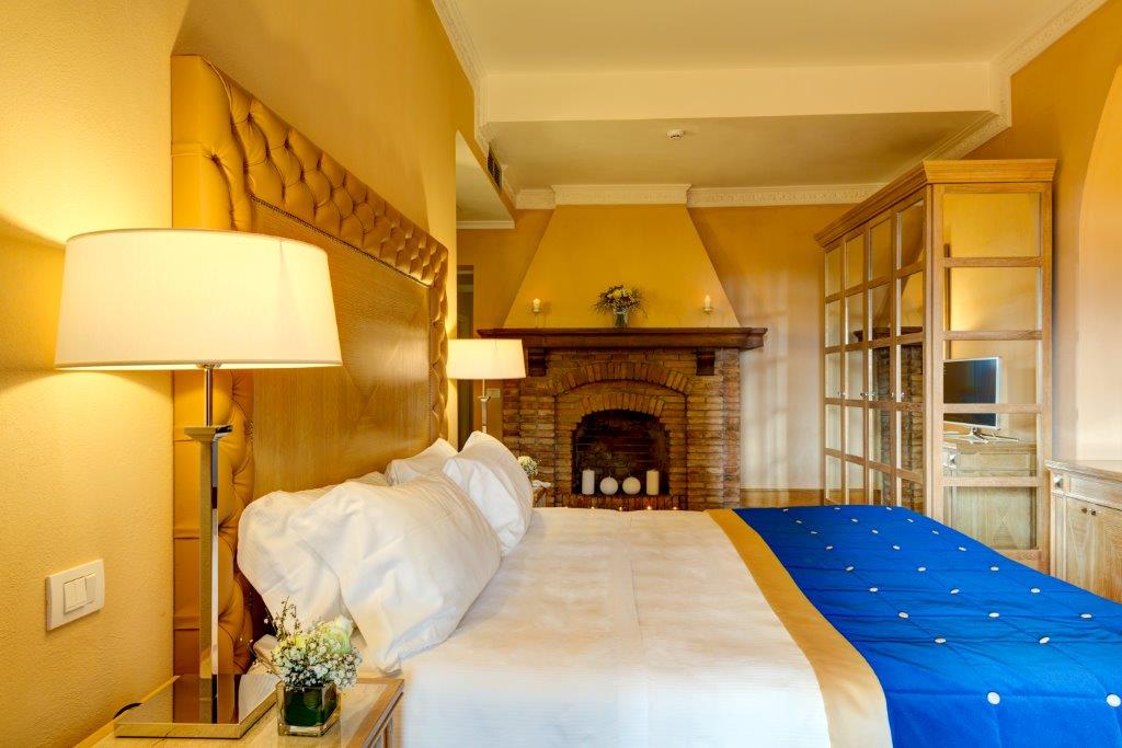 Superior Room with fireplace Villa Tolomei.jpg
